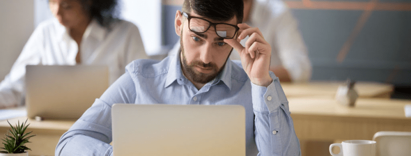 Man looking at a computer screen.