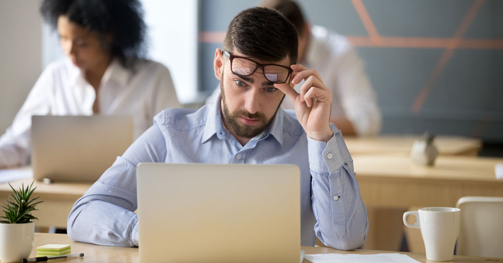 man making mistakes and looking overwhelmed